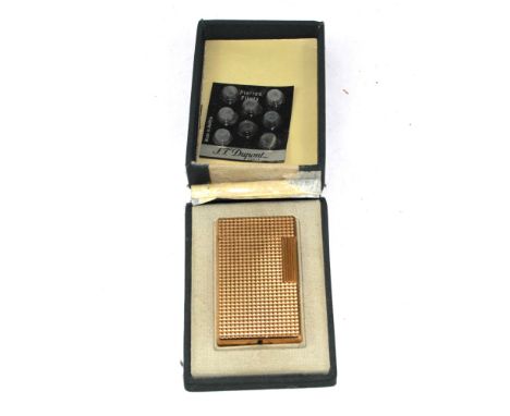 An S.T. Dupont gold plated cigarette lighter, numbered 4653 D.V., cased