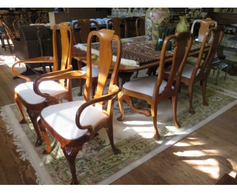 A George II style twin pedestal mahogany dining table, by Brights of Nettlebed, the top on turned stems each on tripod cabrio