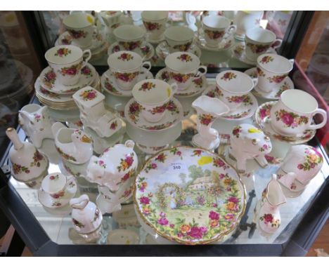 A bone china rose pattern part tea service and other ornaments of the same pattern (34 pieces)