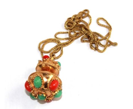 A gold pendant set with coral and aventurine on 18 carat gold chain