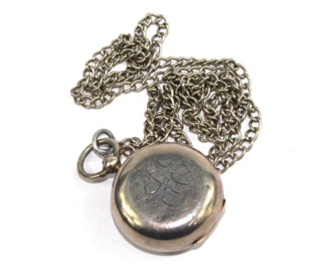 A silver sovereign case on white metal chain