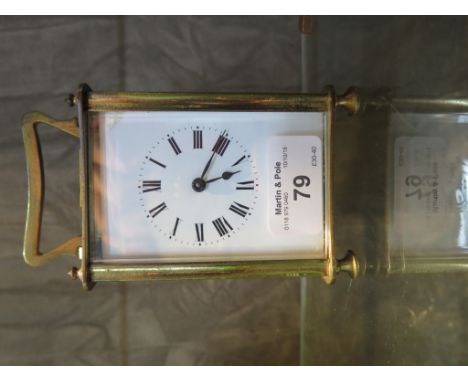 A brass carriage clock, with enamel dial, single train movement, lacking glass panel 14cm high