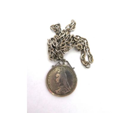 A Victorian silver Crown 1889, suspended from a white metal neck chain