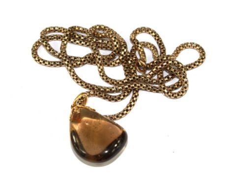 A smoky quartz pendant with 9 carat chain