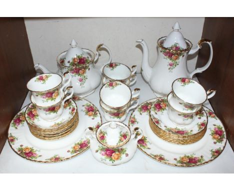 SECTION 15.  A Royal Albert 'Old Country Roses' part tea set comprising teapot, coffee pot, two large plates, six side plates