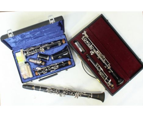 An oboe stamped 'F Buisson, sole distributors Dallas, London' together with a clarinet by Buffet, Crampon &amp; Cie and a stu