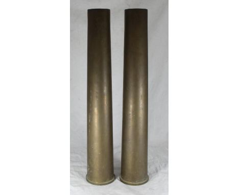 A pair of large brass 75mm gun shells, 63cm high 