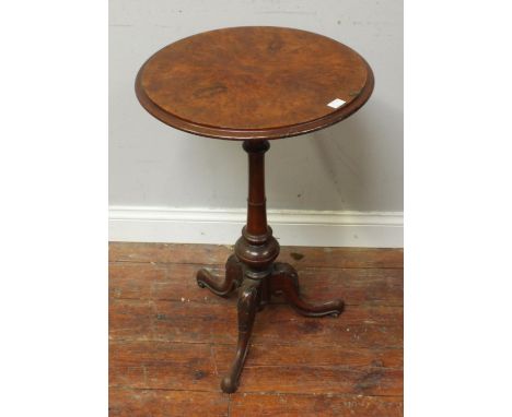 A 19th century stained walnut circular tripod table, on tunred column and carved tripod base, 