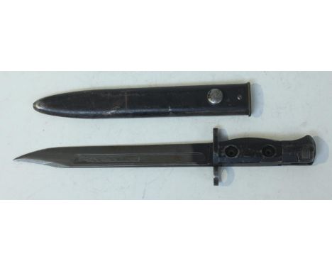 A British 1953 Pattern SLR knife bayonet, with 7.75" fullered blade, black sheet metal pressed two-piece grip and black metal