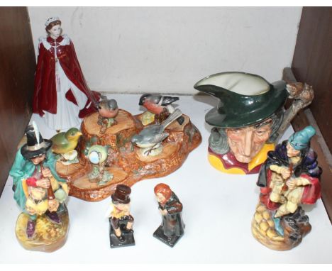 SECTION 20. Royal Doulton figures including 'Mask Seller HN 2103', 'Pied Piper HN2102', small Fagin and Sam Weller, a large P