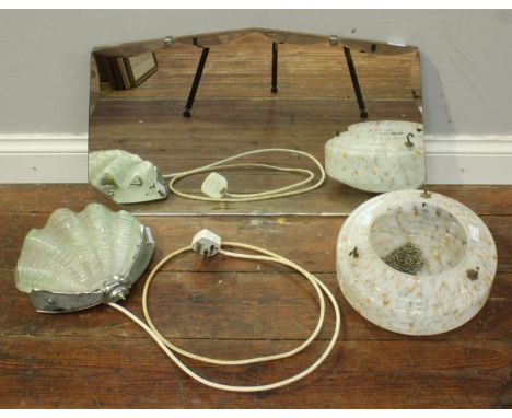 An early 20th century wall mirror with shaped bevelled edges and silver mounts, together with an Art Deco glass and chrome wa