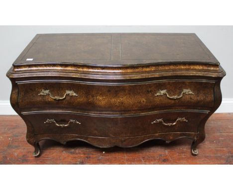 A modern two-drawer commode in the French 18th century style, with lacquered faux burr-wood finish, 112cm wide 