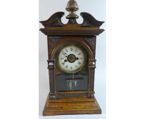 An Early 20th Century American Mantel Clock of Architectural Form with Weighted Pendulum and Alarm Movement, 44cm high 