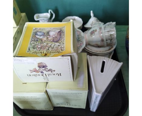 A collection of Royal Doulton Brambly Hedge plates, clock, tea tray, cups and saucers plus a money box and photo frames boxed