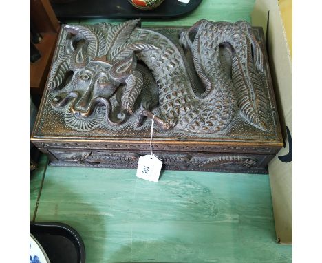 A carved walnut box with boldly carved dragon to lid, 'Made in Kashmir in 1925 by K R Wani'