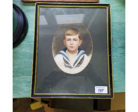 An Edwardian oval watercolour portrait of a boy in Naval dress, 7" x 5"