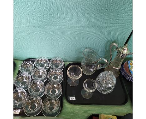 Various glassware including a cut glass claret jug with silver plated mounts, cut glass mid 19th Century water jug, biscuit b