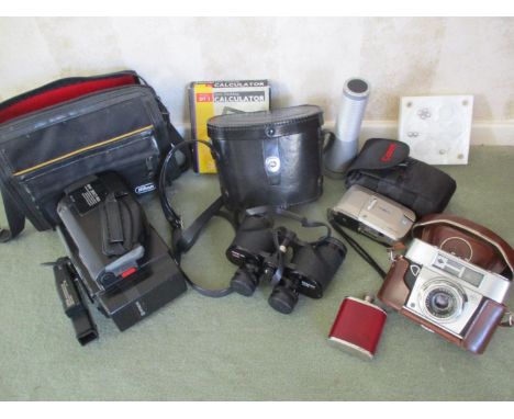 A pair of Canon binoculars in travelling case, a Minolta Vectis 25 camera, an Agfa Colour Aportar camera, and other items 