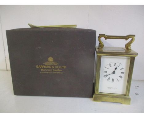 A Garrard &amp; Co. brass cased carriage clock with original box, keys and guarantee 