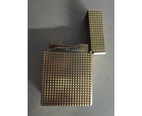 A gold plate DuPont lighters with engine turned decoration 