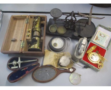 A mixed lot to include a small set of scales, gilt pocket watch, table lighter and other items 