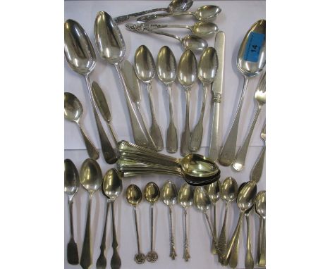 A quantity of silver and white metal flatware, mainly spoons to include a Georgian table spoon and eleven gilt teaspoons, tot