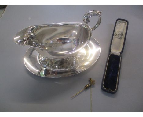 A silver plated gravy boat and tray, together with two yellow metal stick pins and set with amethyst 