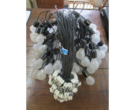 A multi cluster light chandelier with wire attachments 