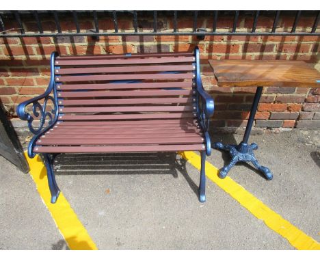 A modern blue painted cast iron garden bench 40"w, and a similar table with an elm top 