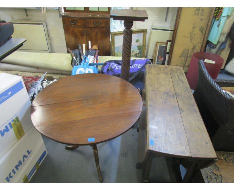 A Georgian oak gate leg drop flap table with two end drawers with brass drop handles, along with a Georgian oak tilt top pede