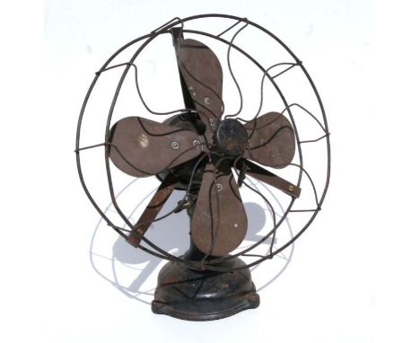 A vintage Art Deco period electric desk fan with cast iron base, 30cms diameter.