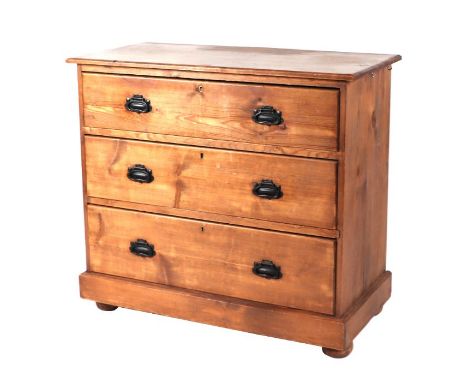 A late 19th century pine chest of three graduated long drawers, on a plinth base, 92cms wide.