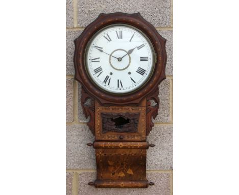 A late Victorian drop-dial wall clock, the white circular dial with Roman numerals, fitted with an 8-day movement, in a walnu