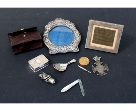 Two silver photo frames; together with a silver caddy spoon; a silver walking cane handle; a gilt metal Masonic medallion and