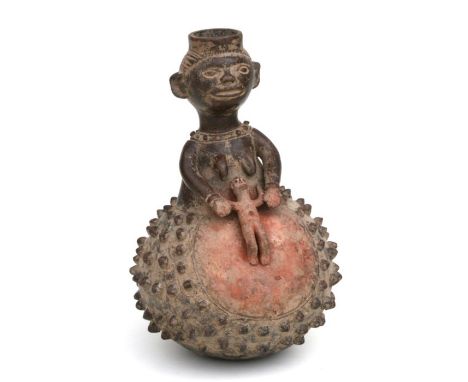 African Art / Tribal Art: An African clay pot depicting a female figure and baby in womb. 25cm high: Provenance: Part of the 