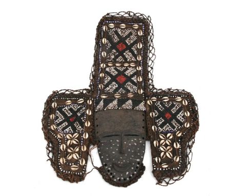 African Art / Tribal Art: An African mask surrounded by three panels comprising beadwork and cowrie shell. 44cm high 34cm wid