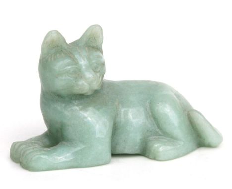 A Chinese carved jade / hardstone figure in the form of a recumbent cat, 8cms wide.