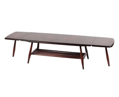 An Ercol mid century dark elm drop-flap coffee table joined by an under tier, 106cms wide.