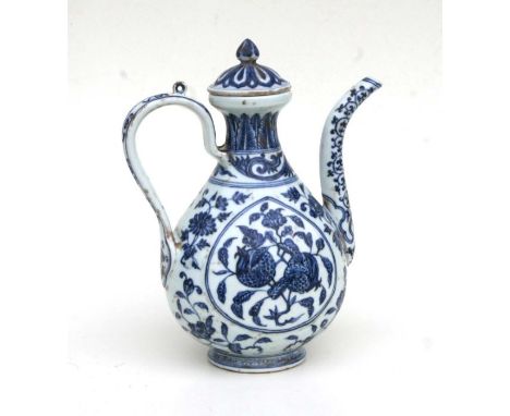 A Chinese blue and white ewer decorated fruit and foliage 27cm high 