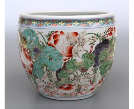 A large Chinese famille rose fish bowl or planter decorated with flowers and birds, 24cms high.Condition ReportGood condition