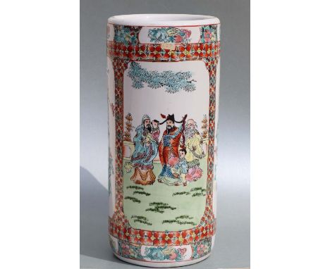 A Japanese cylindrical stick stand, decorated figures and foliage, 46cm high a Japanese crackle glaze vase, 26cm high and ano