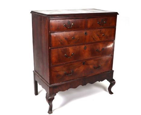 A walnut chest of two short and three graduated long drawers, on cabriole legs (looks to be period drawers in a later made-up
