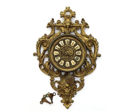 A late 19th / early 20th century Cartel wall clock with brass gilded lacquered case, a brass dial with applied porcelain nume
