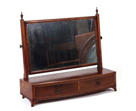A 19th century mahogany bowfronted toilet mirror with two frieze drawers, on bracket feet, 79cms wide.