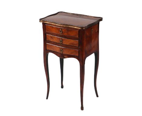 A French kingwood brass mounted bedside table with faux frieze drawer above two drawers, on cabriole legs, 42cms wide.