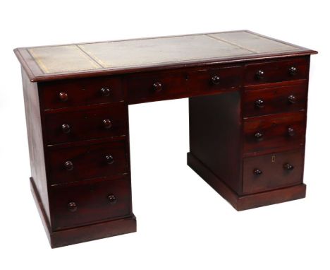 A late Victorian mahogany twin pedestal desk with inset leather top above an arrangement of seven drawers, 127cms wide; toget