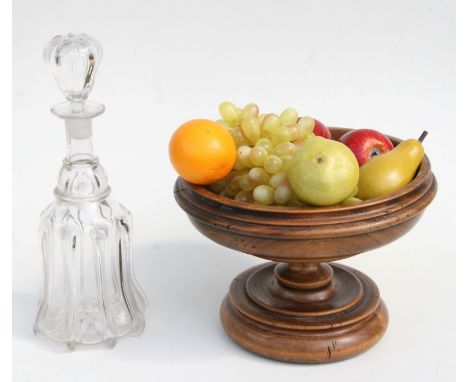 A treen footed bowl, 28cms diameter; together with a selection of faux fruit and a Georgian style mallet shaped decanter.