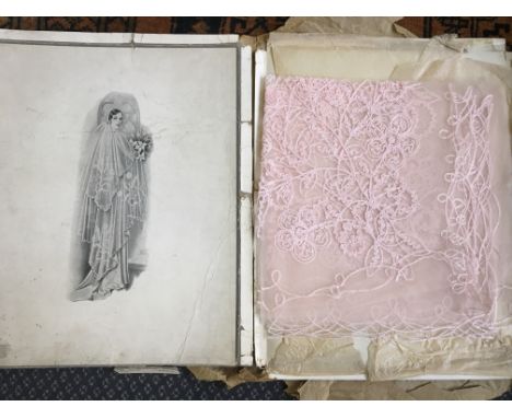 A vintage pink lace bridal veil with original box.