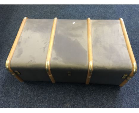 A wood bound travel trunk.