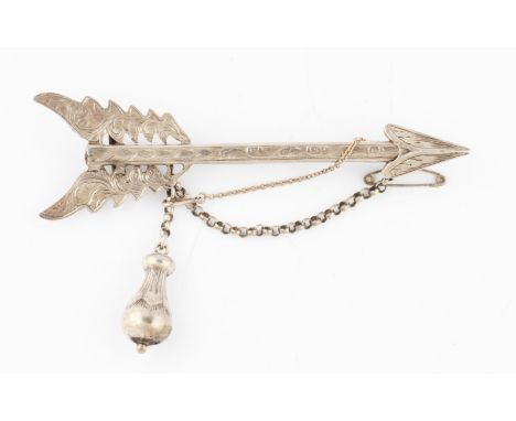 A Victorian arrow brooch, featuring engraved scroll design, stamped reverse 'Regd 30 March 1848', length 9.5cm.